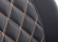 Two toned W diamond pattern quilt with a perforated surface